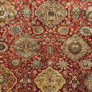 Red and yellow oriental rug for rental.