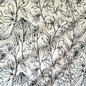 Black and tan botanical embroidered tablecloth for rental.